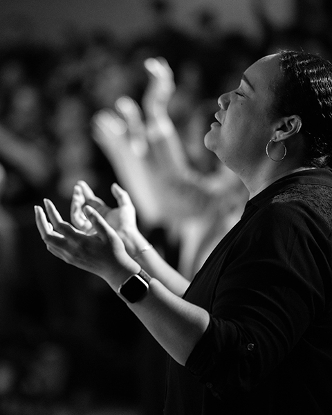 Congregation engaged in worship during Sunday service