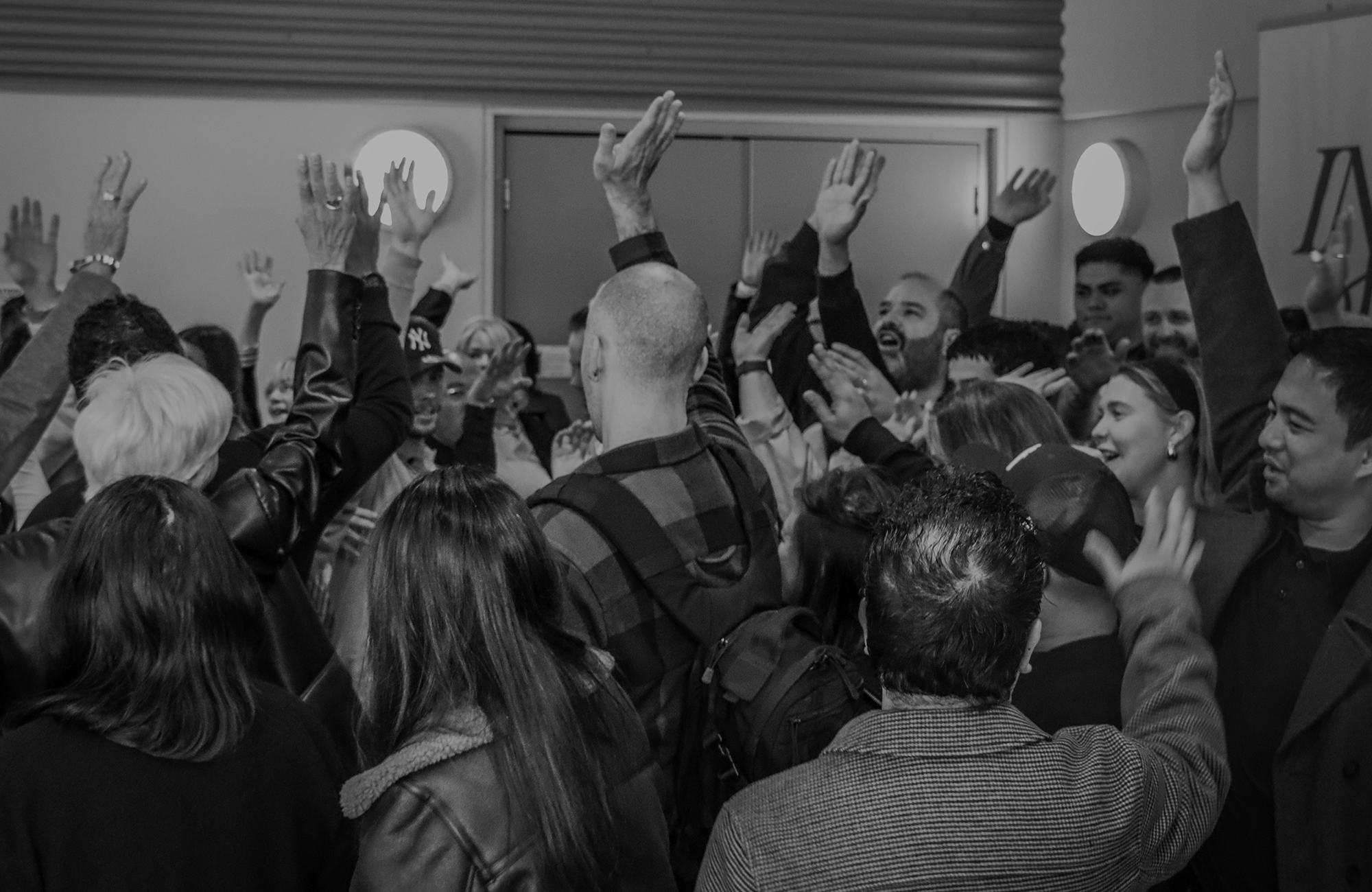 Parable Church worship gathering with raised hands